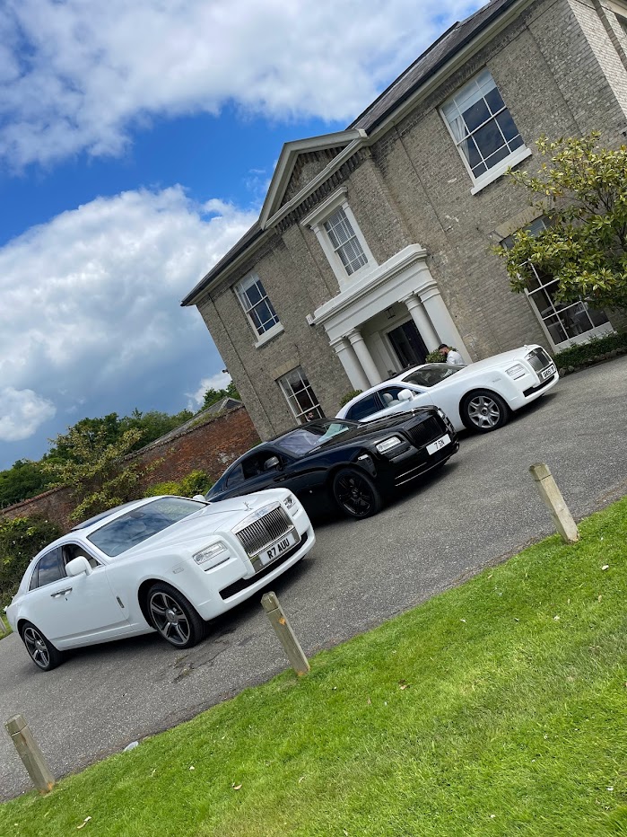 Rolls Royce Ghost parked outside an ongoing corporate event
